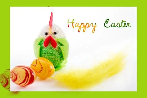 Happy Easter. Colorful easter chick, eggs and yellow feather Stock Photos