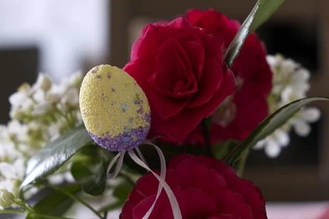 Happy Easter. Colorful Easter chocolate eggs with cherry blossoms flat lay on Stock Photos