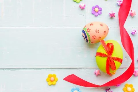 Happy easter! Colorful of Easter eggs with red ribbon and colorful of paper f Stock Photos