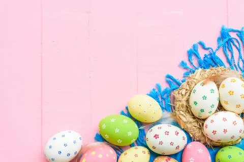 Happy easter! Colorful of Easter eggs in nest with paper star, flower and Fea Stock Photos