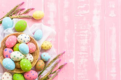 Happy easter! Colorful of Easter eggs in nest with paper star, flower and Fea Stock Photos