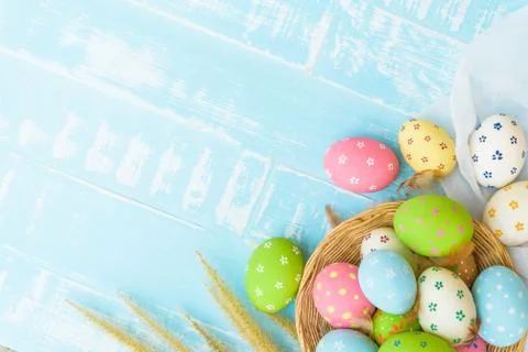 Happy easter! Colorful of Easter eggs in nest with paper star, flower and Fea Stock Photos