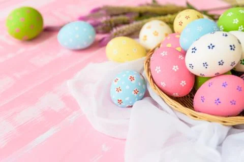 Happy easter! Colorful of Easter eggs in nest with paper star, flower and Fea Stock Photos