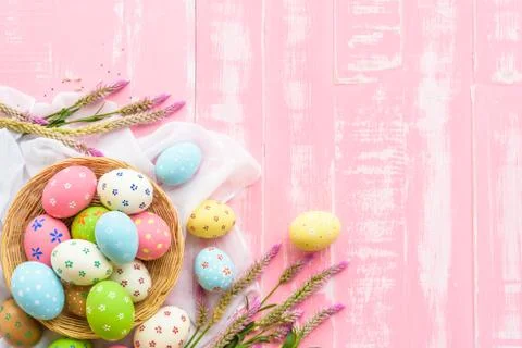 Happy easter! Colorful of Easter eggs in nest with paper star, flower and Fea Stock Photos