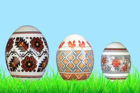 Happy Easter. Colorful easter eggs on green grass. Stock Photos