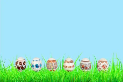 Happy Easter. Colorful easter eggs on green grass. Stock Photos