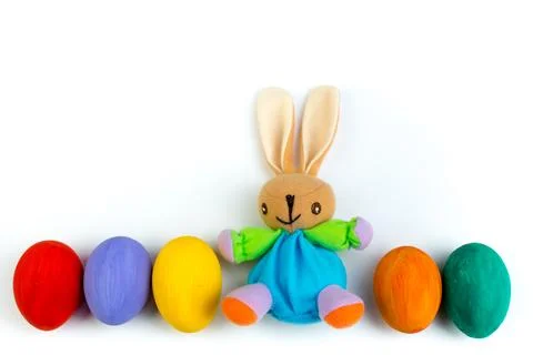 Happy Easter. Colorful easter eggs and rabbit on isolated white background. Stock Photos