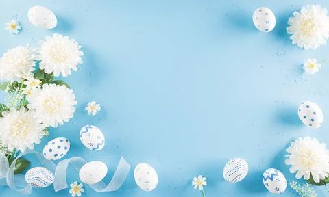 Happy easter! Colourful of Easter eggs in with flower on pastel blue backgrou Stock Photos