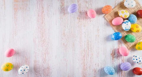 Happy easter! Colourful of Easter eggs with flower on pastel blue wooden back Stock Photos