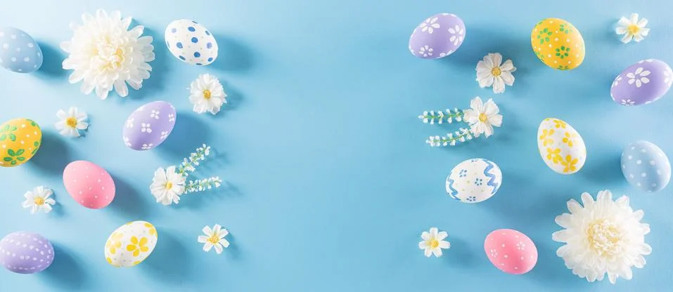 Happy easter! Colourful of Easter eggs in with flower on pastel blue backgrou Stock Photos