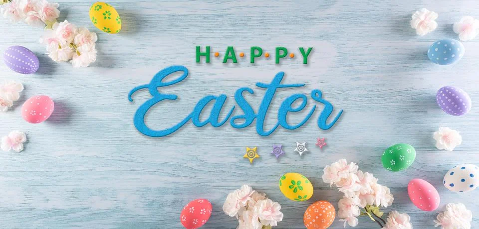 Happy easter! Colourful of easter eggs with flower and the text on pastel blu Stock Photos