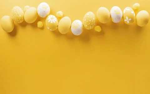 Happy easter! Colourful Easter eggs on yellow background. Decoration concep.. Stock Photos