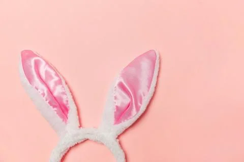 Happy Easter concept. Decorative bunny ears furry costume toy isolated on tre Stock Photos