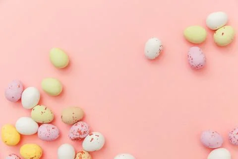 Happy Easter concept. Easter candy chocolate eggs and jellybean sweets isolated Stock Photos