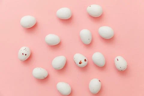 Happy Easter concept. Easter candy chocolate eggs and jellybean sweets isolated Stock Photos