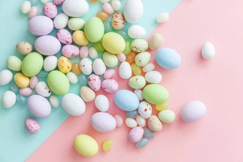 Happy Easter concept. Easter candy chocolate eggs and jellybean sweets isolat Stock Photos