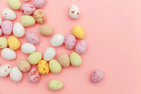 Happy Easter concept. Easter candy chocolate eggs and jellybean sweets isolat Stock Photos