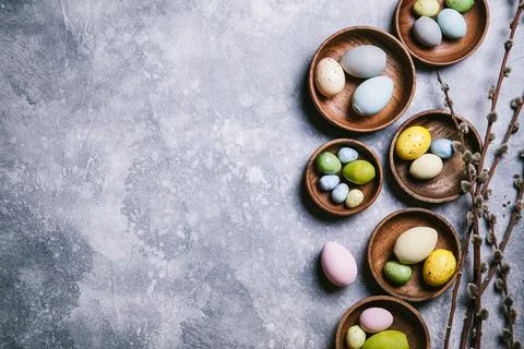 Happy easter concept. Multicolored easter painted eggs and branches with buds Фото
