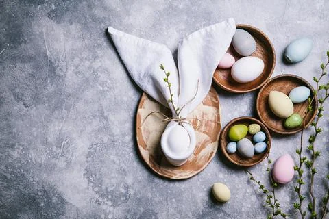 Happy easter concept. Multicolored easter painted eggs and branches with buds Stock Photos