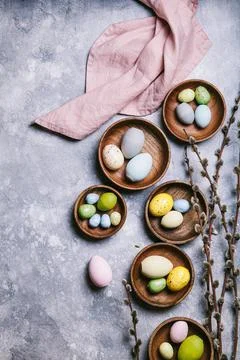 Happy easter concept. Multicolored easter painted eggs and branches with buds Stock Photos