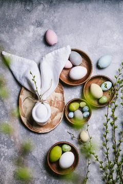 Happy easter concept. Multicolored easter painted eggs and branches with buds Stock Photos