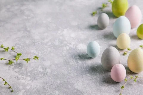 Happy easter concept. Multicolored easter painted eggs and branches with buds Stock Photos