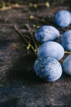 Happy easter concept. Multicolored easter painted eggs in blue tones and bran Фото