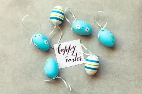 Happy Easter concept. Preparation for holiday. Blue Easter eggs Inscription.. Stock Photos
