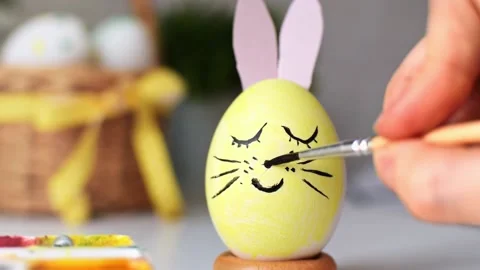 Happy Easter concept. Spring holiday preparation. Egg with pink bunny ears. Stock Footage 234686699