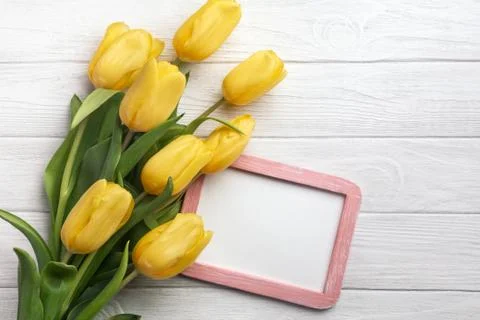 Happy Easter. Congratulatory easter background. Easter eggs and flowers. Stock Photos