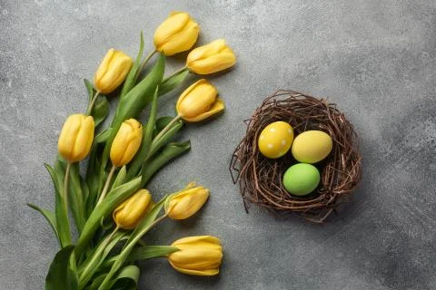 Happy Easter. Congratulatory easter background. Easter eggs and flowers. Stock Photos