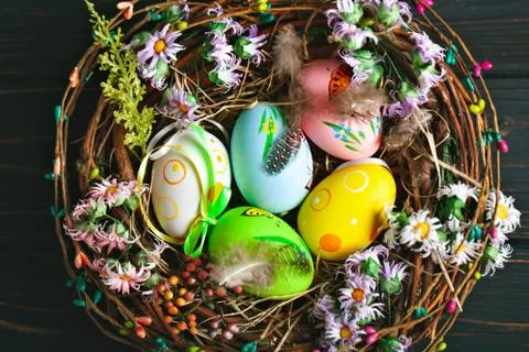 Happy Easter. Congratulatory easter background. Easter eggs and flowers. Back Stock Photos