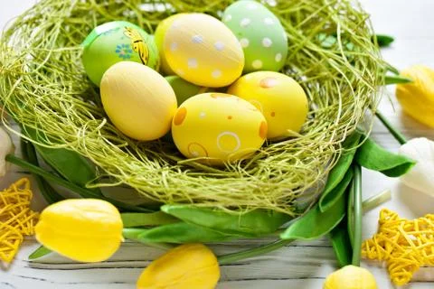 Happy Easter. Congratulatory easter background. Easter eggs and flowers. Back Stock Photos