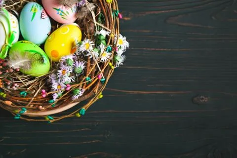 Happy Easter. Congratulatory easter background. Easter eggs and flowers. Back Stock Photos