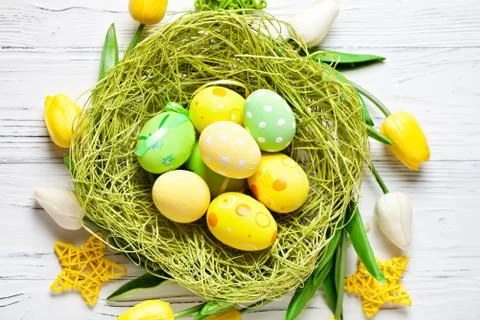 Happy Easter. Congratulatory easter background. Easter eggs and flowers. Back Stock Photos
