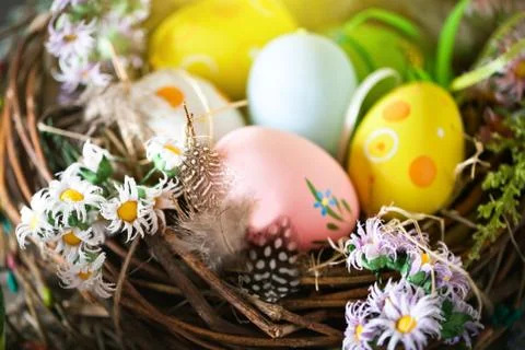 Happy Easter. Congratulatory easter background. Easter eggs and flowers. Back Stock Photos