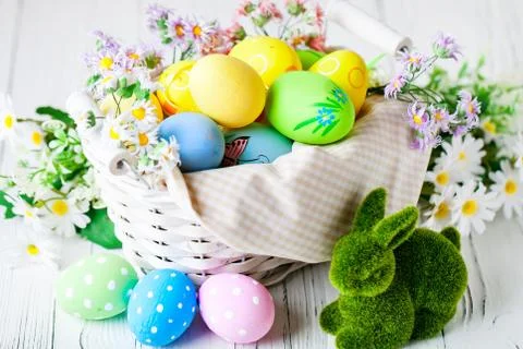 Happy Easter. Congratulatory easter background. Easter eggs and flowers. Back Stock Photos