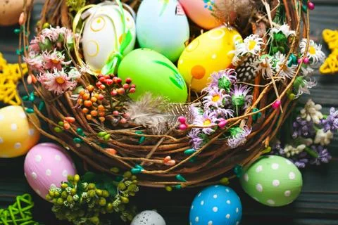Happy Easter. Congratulatory easter background. Easter eggs and flowers. Back Stock Photos