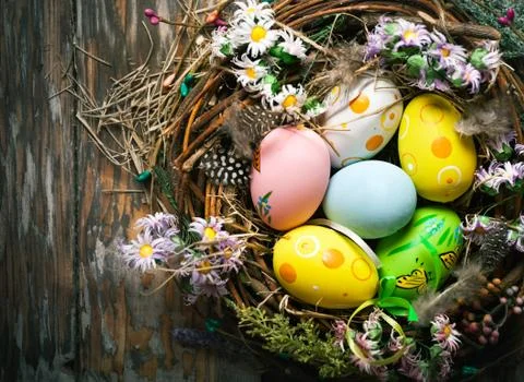 Happy Easter. Congratulatory easter background. Easter eggs and flowers. Back Stock Photos