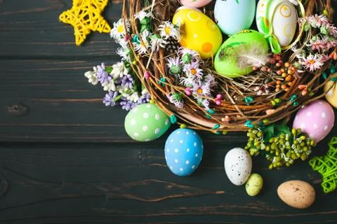 Happy Easter. Congratulatory easter background. Easter eggs and flowers. Back Stock Photos