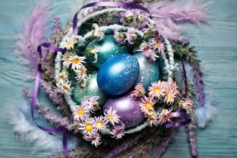 Happy Easter. Congratulatory easter background. Easter eggs and flowers. Back Stock Photos