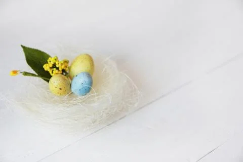Happy Easter. Congratulatory easter background. Easter eggs and flowers. Stock Photos