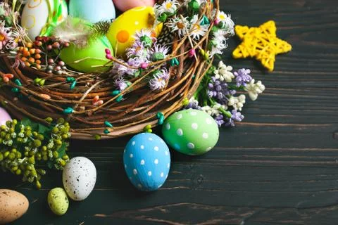 Happy Easter. Congratulatory easter background. Easter eggs and flowers. Back Stock Photos