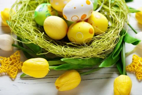 Happy Easter. Congratulatory easter background. Easter eggs and flowers. Back Stock Photos