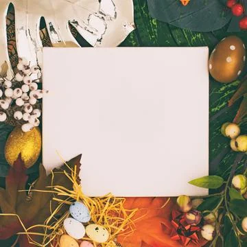 Happy Easter. Congratulatory easter background. Easter eggs and flowers. Flat Stock Photos