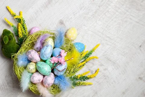 Happy Easter. Congratulatory easter background. Easter eggs and flowers Stock Photos