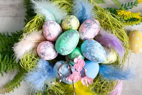 Happy Easter. Congratulatory easter background. Easter eggs and flowers Stock Photos