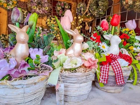 Happy Easter. Congratulatory easter background. Easter eggs Bunnies and flowers. Stock Photos