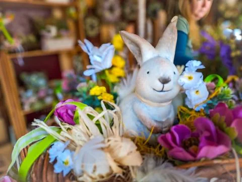 Happy Easter. Congratulatory easter background. Easter eggs Bunnies and flowers. Stock Photos