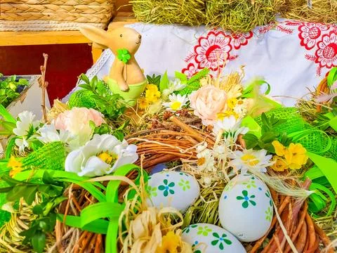 Happy Easter. Congratulatory easter background. Easter eggs Bunnies and flowers. Stock Photos